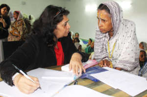 A widow registers herself during healtch camp