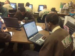 Joshua completing scholarship application