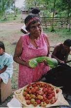 Bibidilia, a community elder, with her harvest