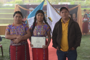 Susana and her parents - middle school graduation