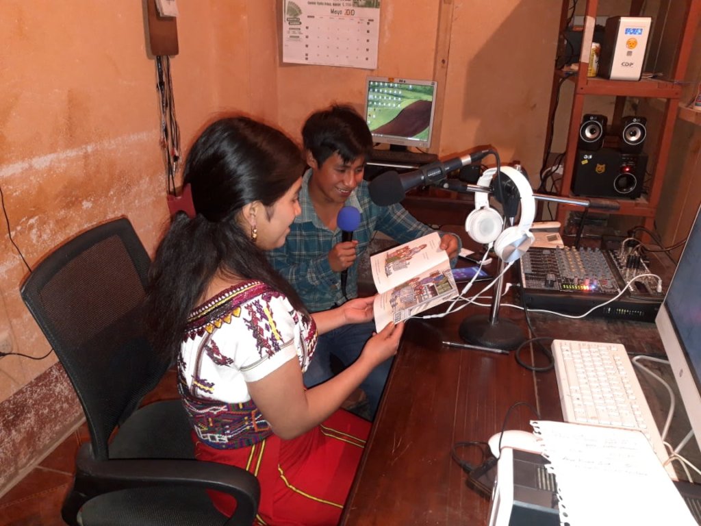 Olga and David record a story on local radio
