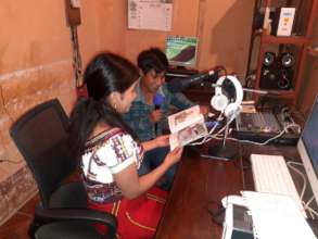 Olga and David record a story on local radio