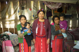 Teresa (left) at home with her family