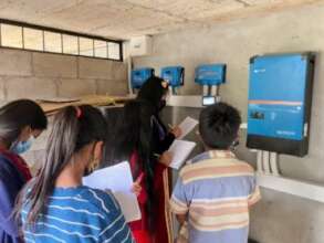 Students visiting the solar panel control room