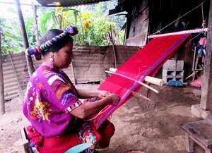 Maria supports her family by weaving