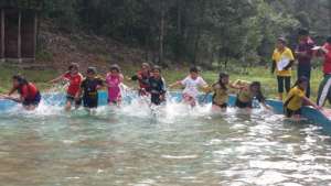 Scholars participating in obstacle course games