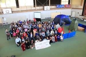 Group photo at emergency shelter mock-up