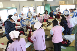 WaiWai workers assembling their disaster kits