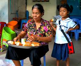 Housemother preparing breakfast for the children