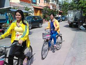 Mealea and friend bicycle through Banteay Meanchey