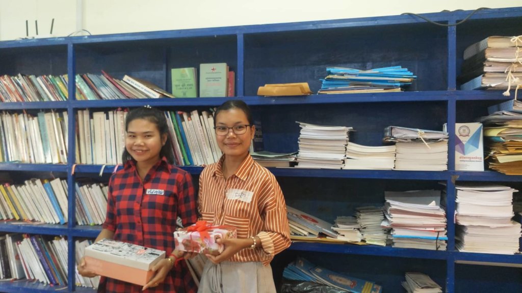 Sophin (left) receives gift for journal writing!