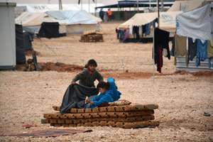 Trying to stay warm. Courtesy of Mercy Corps