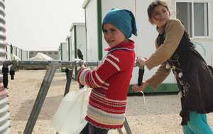 Girls collect water. Courtesy of OXFAM