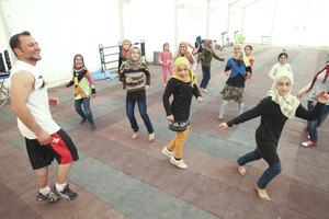 Children dancing, photo courtesy of Mercy Corps