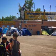 Informal refugee camp at a gas station in Greece