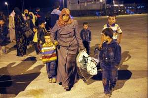 Family Traveling to Refugee Camp