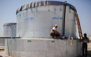 Water tanks, photo courtesy of Oxfam America