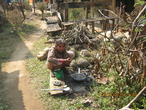 An  woman washing  dishes at Manakamana