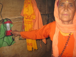 An old aged  woman   trying to learn how to use