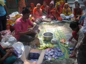 Old age people waiting to receive food materials