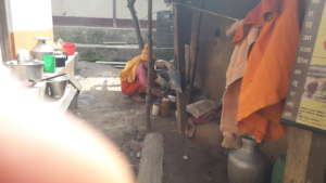 An old woman  preparing food