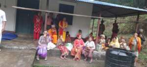 People relaxing  after receiving food materials