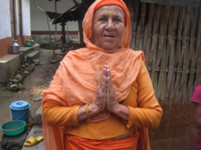 One of the elderly women  greets us