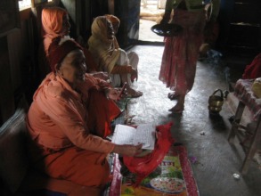 Some elderly people in the prayer room praying
