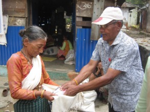 SESF Chairperson distributing food materials.