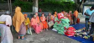 People gathering  to receive food materials