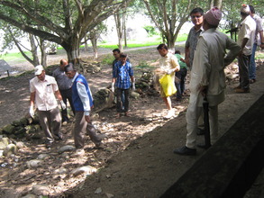 People cleaning  around the  old age home