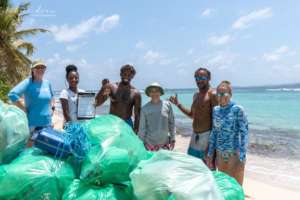 Weighing and recording litter. Photo: Keone Drew