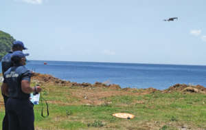 Members of the Coast Guard learn to fly a drone.