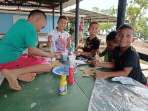 Children prepare their masks