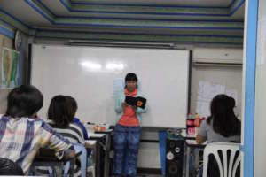 A student from BEAM reads out her cover letter