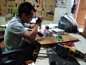 A Solbakken technician working on solar equipment