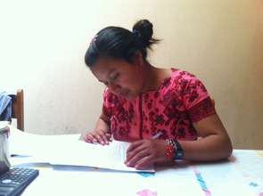 Alicia signing her One New Education scholarship