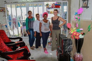 Ana in her shop with Foundation team!