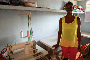 Gina in her sewing room -2nd round loan grantee!