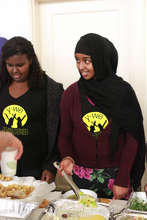 Kadija serving food at Y-WE Dinner
