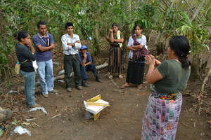 Group members look on during a training