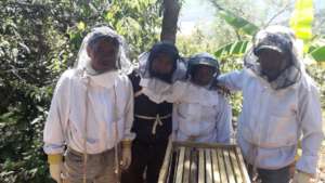 Genaro (in black) with group members at a training
