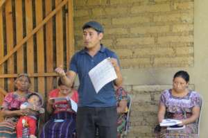 Genaro leads a beekeeping lesson