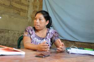 Maribel speaks with project staff