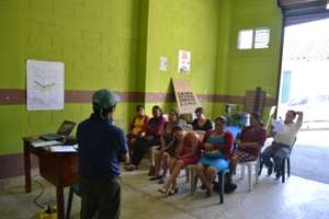 Genaro teaching the basics of beekeeping