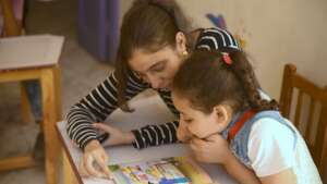 A Big Sister helps her Little Sister learn