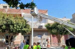 Girls overlook new streetlight installation