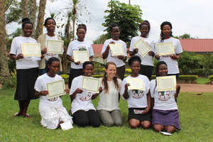 Girls with well earned graduation certificates