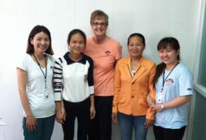 Kieu, mom and MEDRIX staff in 2014: healthy again