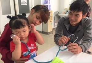Huong and her parents before surgery